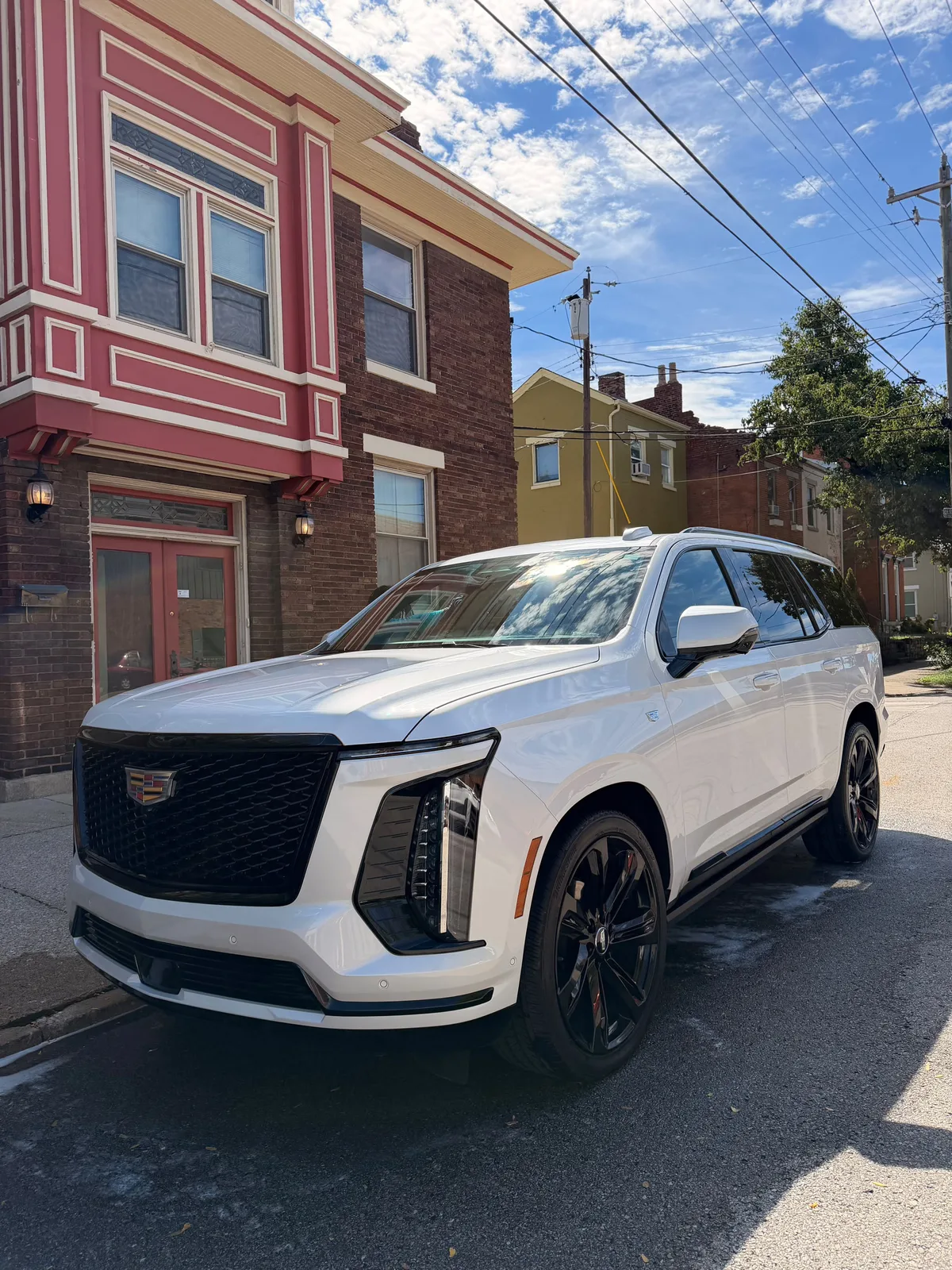 White Cadillac SUV exterior detail
